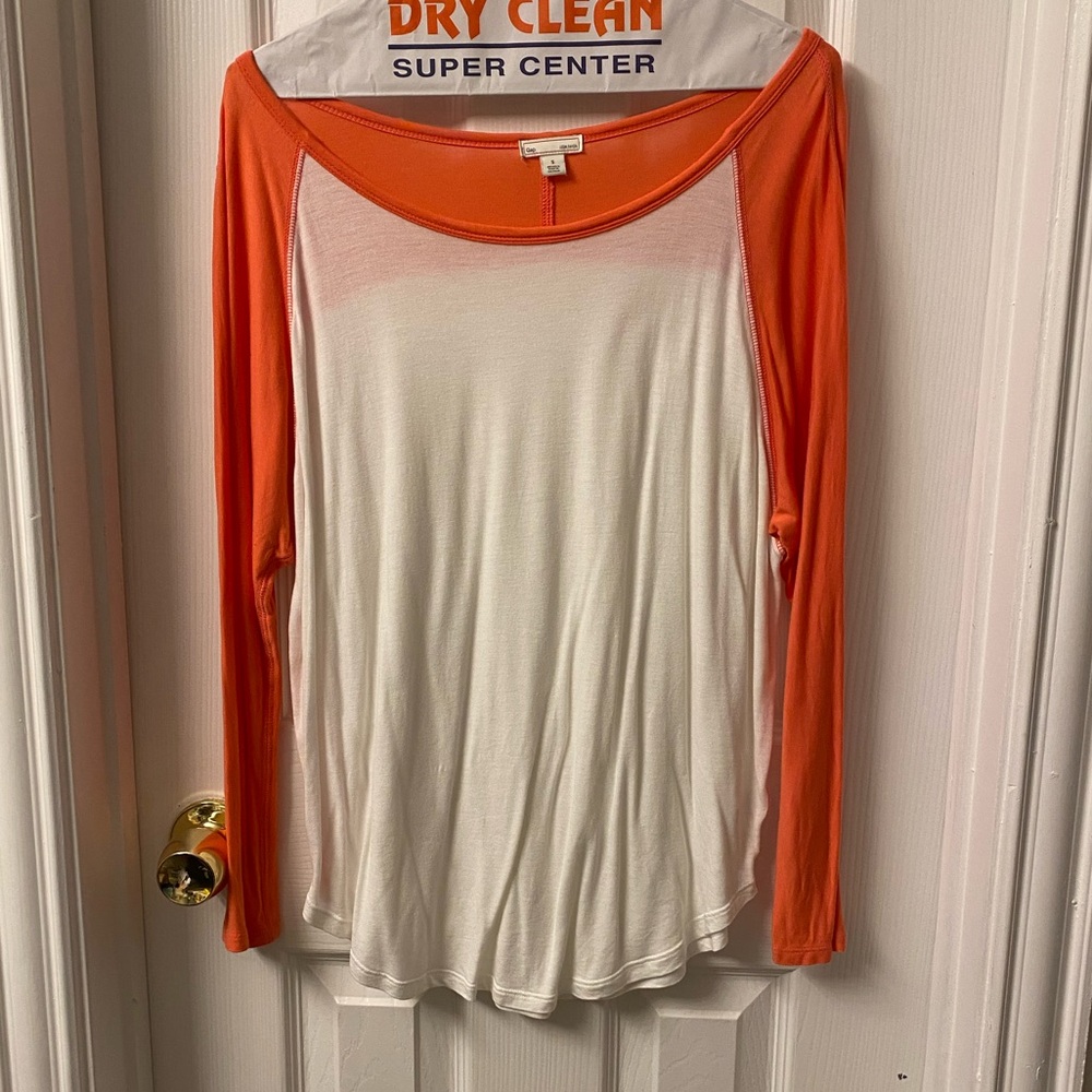 Orange and white scoop neck t-shirt.